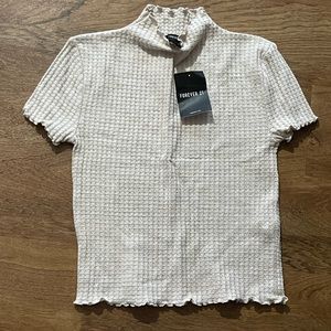 Forever21 waffle style shirt lettuce detail. Can be worn as crop top size down.